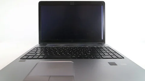 Hacker writing code on a laptop on white background Stock Footage 128470695