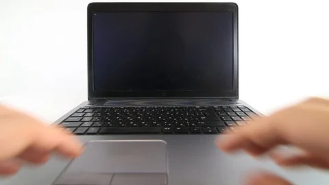 Hacker writing code on a laptop on white background Stock Footage 128470759