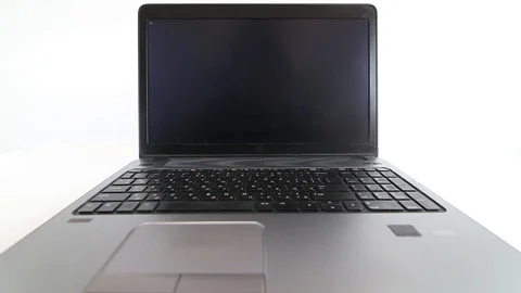 Hacker writing code on a laptop on white background Stock Footage 128470763