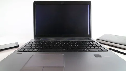 Hacker writing code on a laptop on white background Stock Footage 128470860