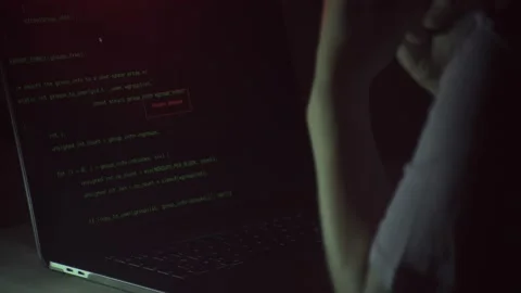 Hacker writing codes to make an illegal cyber attack Stock Footage 155941461