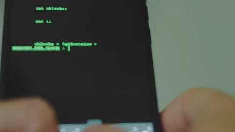 Hacker writing hacking code using smartphone. Man using dark web with smartphone Stock Footage 274082332