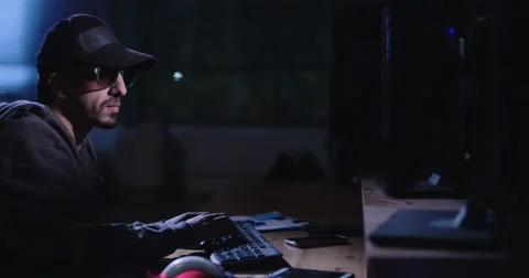 Hacker writing lines of code while hacking systems Stock Footage 68294330
