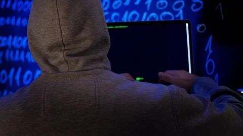 Hacker writing programming code or using virus program for cyber attack. Stock Footage 106370189