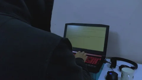 A hacker/person/student typing and coding at night Stock Footage 100457962
