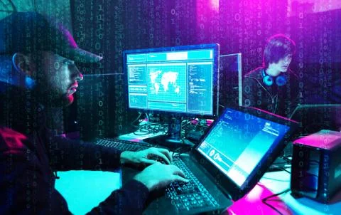 Hackers are breaking server using computers. Cybercrime concept. Stock Photos