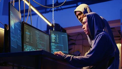 Hackers brainstorm cracking methods Stock Photos