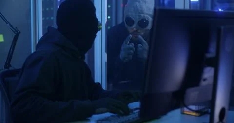Hackers breaking into a data center Foto stock