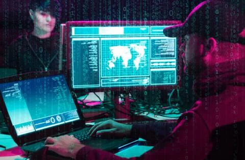 Hackers breaking server using computers. Cybercrime concept. Stock Photos