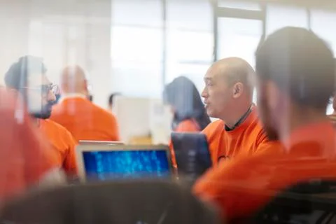 Hackers coding for charity at hackathon Stock Photos