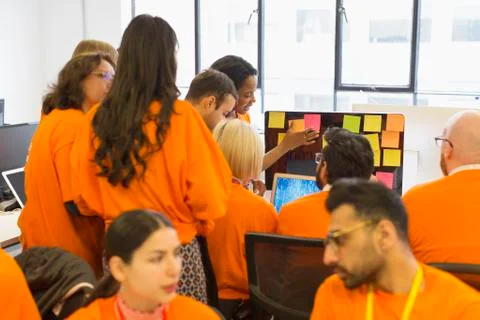 Hackers coding for charity at hackathon Stock Photos