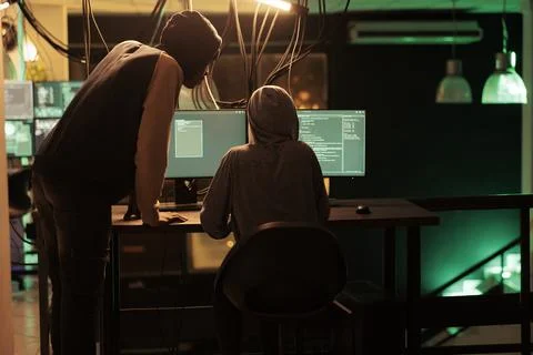 Hackers coding malicious software, cracking database password Stock Photos