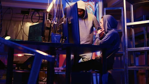 Hackers coding malware together Stock Footage 256945064