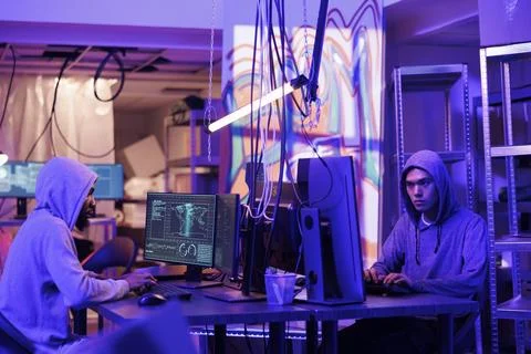 Hackers collaborating on coding virus Stock Photos