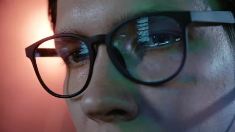 Hacker's eyes reflecting computer screen code Stock Footage 341662480