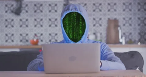 Hacker's face is obscured by running matrix code. Filled with green light, vfx Vidéo 239065193