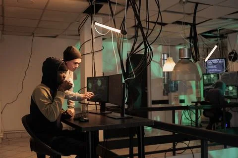 Hackers group coding internet virus program, developing malicious software 스톡 사진