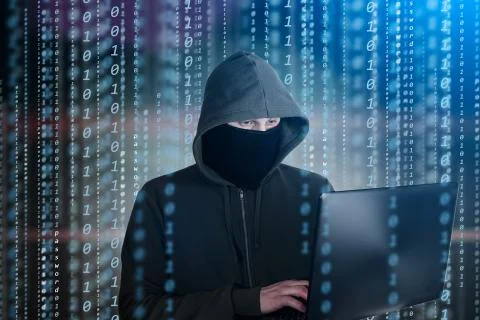 Hackers programmer look on screen and writes the program code hack information 写真素材