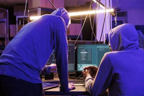 Hackers running malware on computer Stock Photos