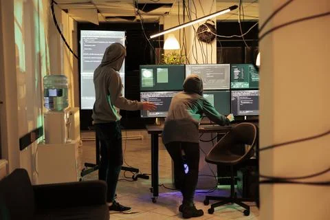 Hackers running spyware code on computer, hacking database Foto stock