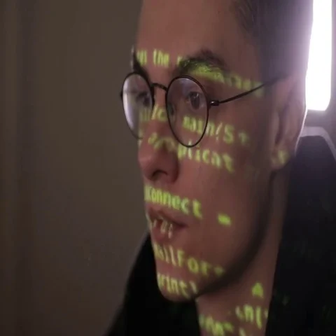 Hackers screen with binary code, data code reflectied in programmer's glasses Video stock 69405226