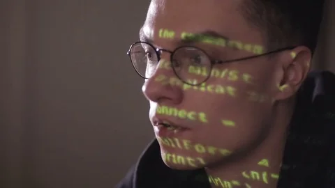 Hackers screen with binary code, data code reflectied in programmer's glasses Video stock 69806927