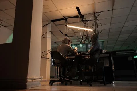 Hackers team coding internet virus program, hacking computer system Stock Photos