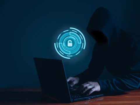 Hackers work on laptops in the dark. The concept of information security in t Stock Photos