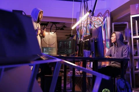 Hackers working to hack computer system Stock Photos