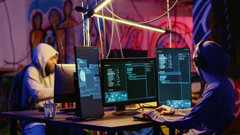 Hackers writing location spoofing code 库存影片 258621650