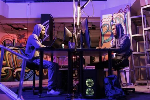 Hackers writing malicious code Stock Photos