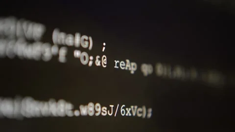 Hacking code program in close-up scrolling on the computer's monitor Stock Footage 199019179