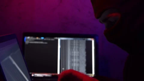 Hacking a computer system. Stealing digital data. Crime. Close-up Stock Footage 124360793