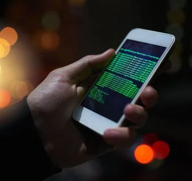 Hacking computers is so old school. an unidentifiable computer hacker using a 스톡 사진