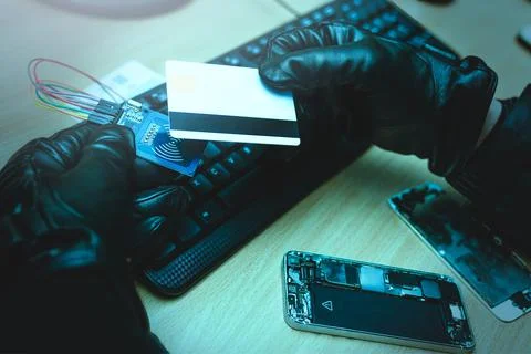 Hacking concept. Hacker trying to steal mobile payment information. close up  写真素材