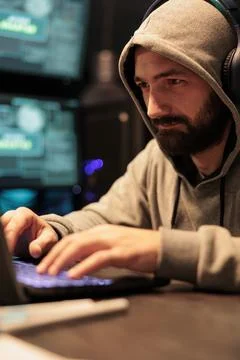 Hacking developer using computer to break system Stock Photos