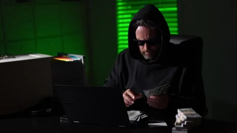 Hacking expert. Hacking and malware concept. Hacker steal money in the office Stock Footage 318947593