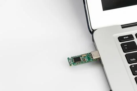 Hacking Laptop with USB device Stock Photos