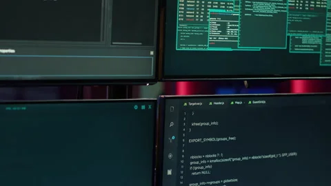 Hacking malware programming script on monitors in underground base Stock Footage 275752250