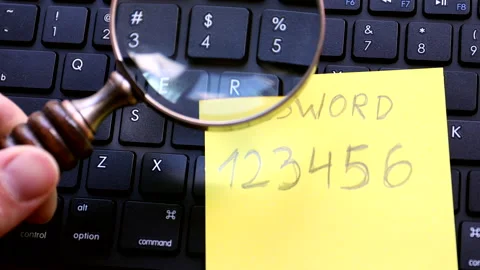 Hacking password concept. Exploring password with magnifier Stock Footage 138616661