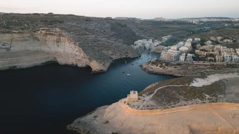 Had Dingli Cliffs and town bay at sunset, Malta. Aerial cinematic drone view Stock Footage 270444792