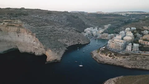 Had Dingli Cliffs and town bay at sunset, Malta. Aerial cinematic drone view Stock Footage 270444817