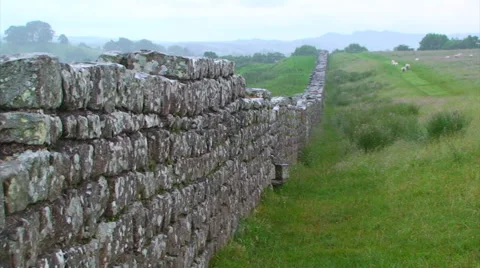 Hadrian's Wall gets lost in the distance and rainfall, zoom out Stock Footage 39993686