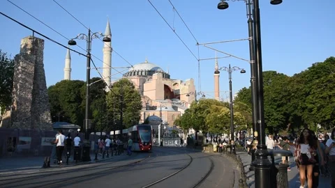 Hagia Sofia Instambul, Turkey. Tram and pedestrians passing by. Video stock 202311054