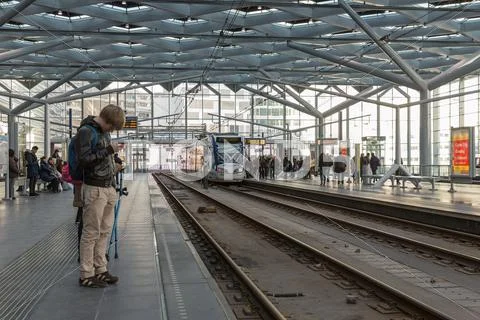 THE HAGUE, THE NETHERLANDS - FEB 03: Travelers waiting for the tram on Februa Stock Photos