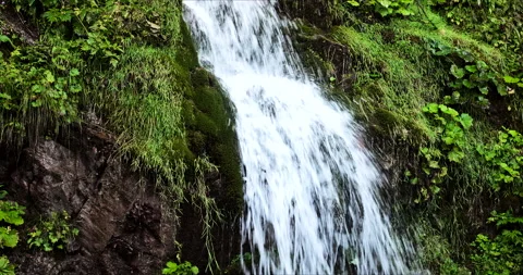 Hahnenkamm, Austria - September 01, 2021: Alpine stream Stock Footage