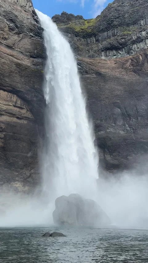 Háifoss waterfall drops into a clear river in Iceland’s remote highlands  Stock Footage 312232730