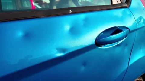 Hail damage to car bodywork Stock Footage 325520040