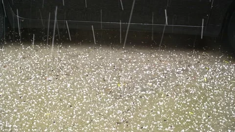 Hail falling  and a parked car Vídeo Stock 166115872