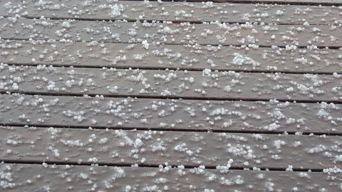 Hail falling down on the wooden deck Video stock 79862211